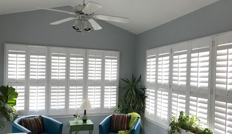 Austin living room with fan and shutters